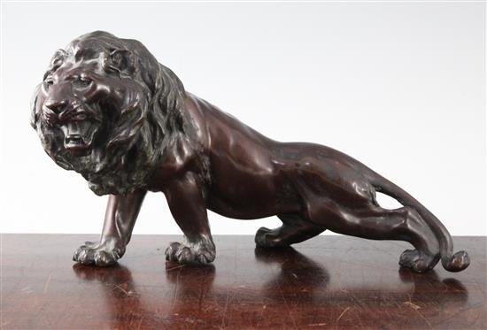 A Japanese brown patinated bronze figure of a roaring lion, Meiji period, length 34cm